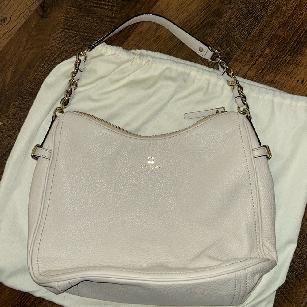 Kate Spade. Blush pink purse gently used. Leather with gold accents